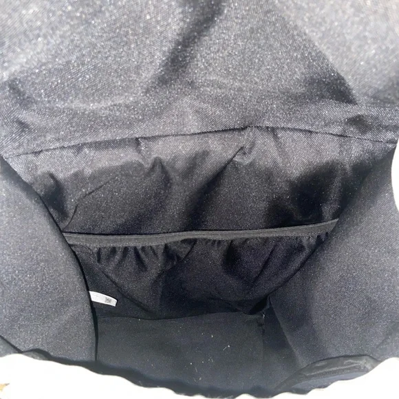 Rains Cream and Black Backpack Roll-Top Design